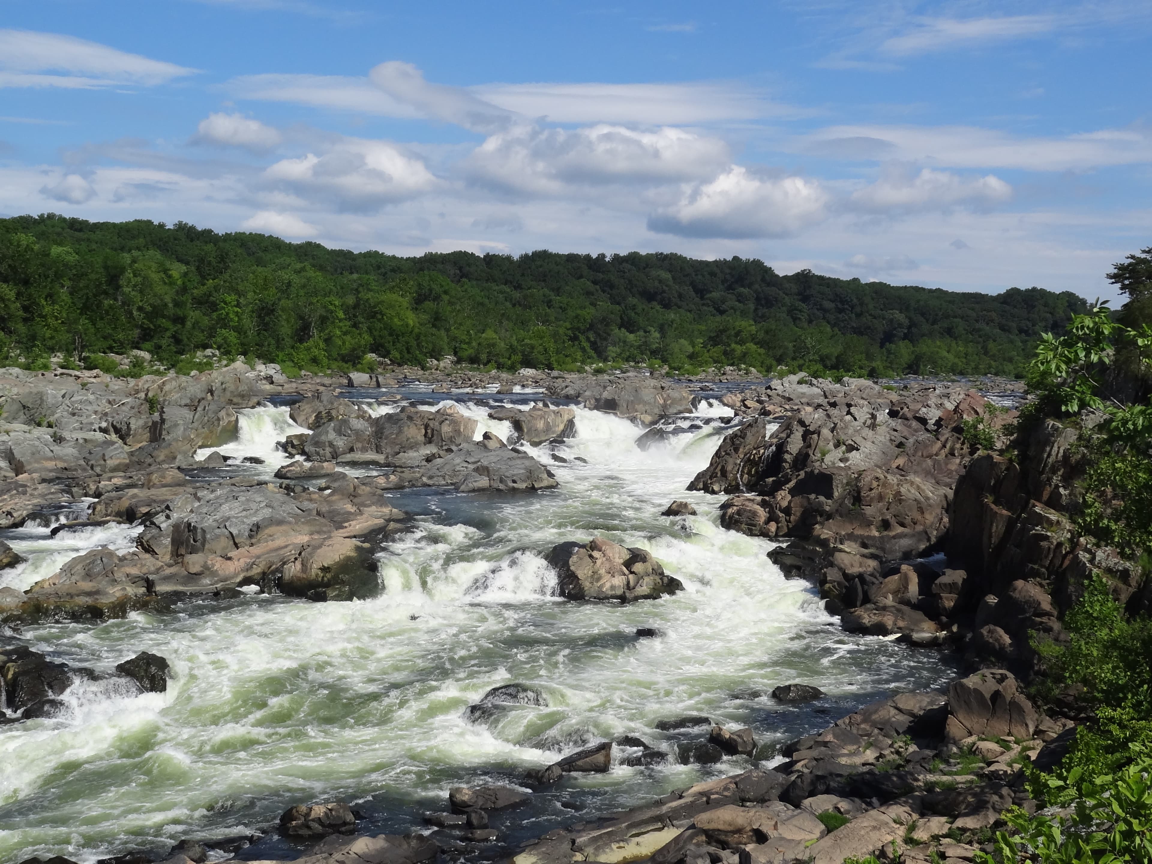 The rushing river cascades over the rocks of the Potomac